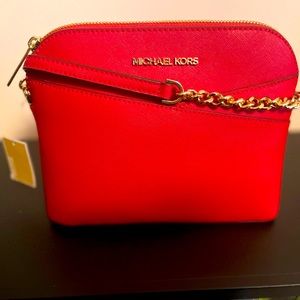 Brand new Michael kors cross body never worn.